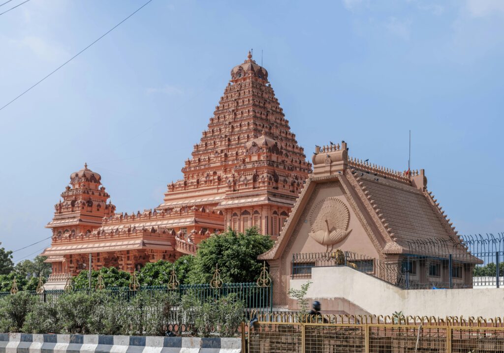 Beautiful Hindu temple showcasing intricate architecture in Delhi, India on a clear day.